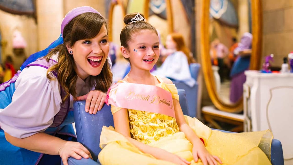 Child dressed as a Disney princess after a Bibbidi Bobbidi Boutique makeover at Magic Kingdom