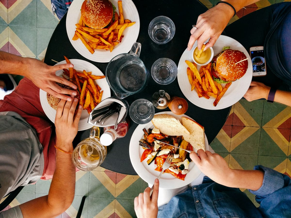 A group of people dining around a table together